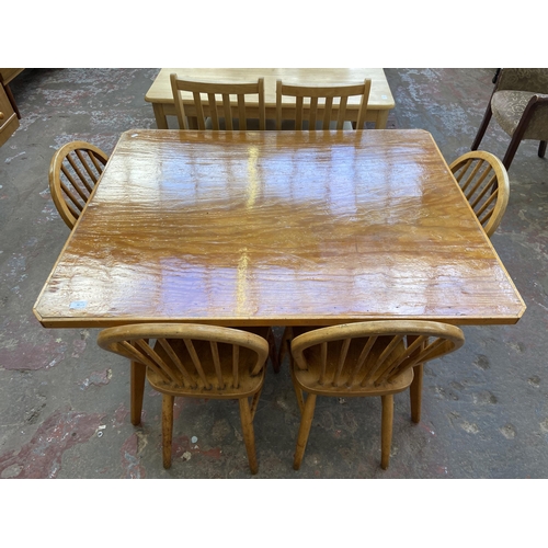 70 - A mid 20th century bespoke oak and beech dining table and four Ercol style elm and beech dining chai... 