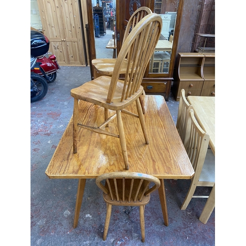 70 - A mid 20th century bespoke oak and beech dining table and four Ercol style elm and beech dining chai... 