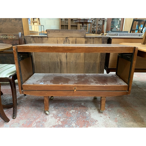 92 - Two pieces of furniture, one mid 20th century rosewood effect metamorphic tea trolley and one white ... 