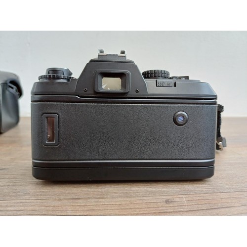 624 - A cased Nikon F-301 35mm SLR camera fitted with Nikkor AF 1:3.3-4.5 35-70mm lens