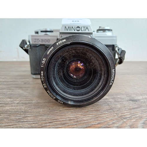 629 - A Minolta X-300 35mm SLR camera fitted with 1:3.5 35-70mm MD zoom lens