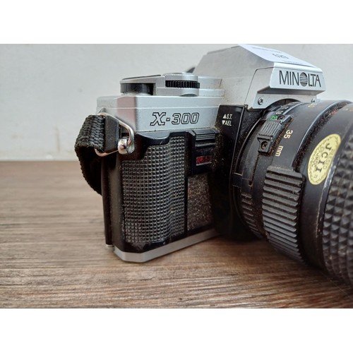 629 - A Minolta X-300 35mm SLR camera fitted with 1:3.5 35-70mm MD zoom lens