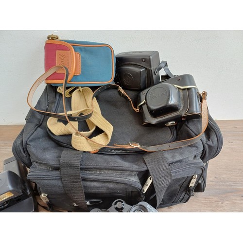 630 - A camera bag containing Polaroid 636 Talking instant camera, cased Haking Halina Paulette Electric 3... 