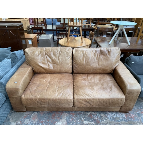 245 - A Halo Furnishings tan leather three seater sofa - approx. 78cm high x 200cm wide x 105cm deep