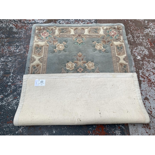 243B - A Chinese floral pattern rug - approx. 6ft x 4ft