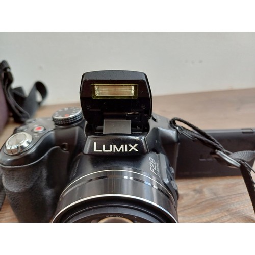 632 - A cased Panasonic Lumix DMC-FZ200 full HD digital bridge camera