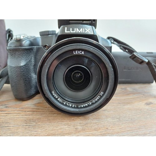 632 - A cased Panasonic Lumix DMC-FZ200 full HD digital bridge camera