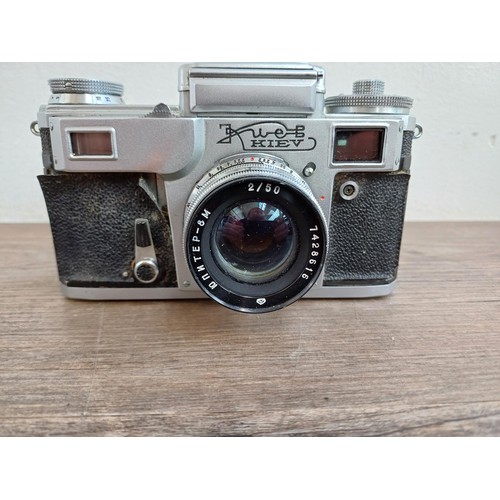 633 - A cased 1974 Zavod Arsenal Kiev 4 35mm rangefinder camera (serial number 7417607) fitted with Jupite... 