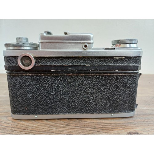 633 - A cased 1974 Zavod Arsenal Kiev 4 35mm rangefinder camera (serial number 7417607) fitted with Jupite... 