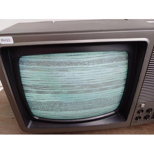 721 - Two cathode ray tube TVs, one Panasonic TC381G 11.5