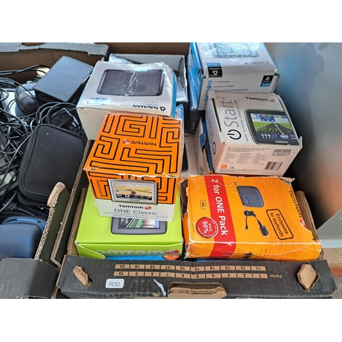 774 - Three boxes containing a large collection of boxed and unboxed SatNavs to include TomTom, Garmin, Na... 