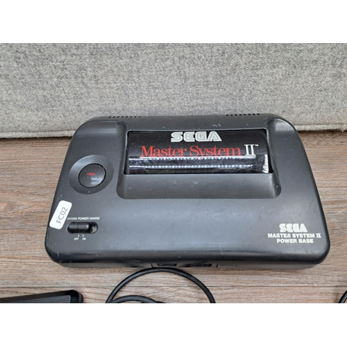 776 - A SEGA Master System II with three controllers