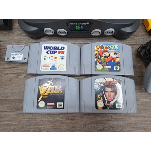 777 - A Nintendo 64 console with two controllers, power supply, Controller Pak and four games; The Legend ... 