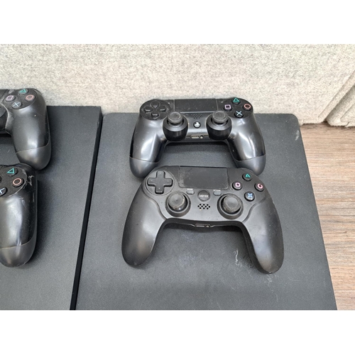 782 - Two Sony PlayStation 4 consoles, one CUH-1116A and one CUH-2016A one third-party and three official ... 