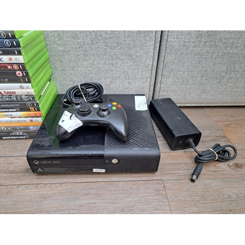 784 - A Microsoft Xbox 360 E console with controller, power supply and a large collection of games