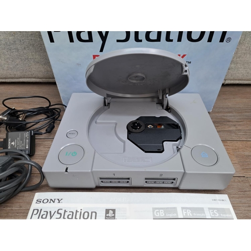 785 - A boxed Sony PlayStation SCPH-9002 console with controller, AC adapter, RFU adapter and instruction ... 