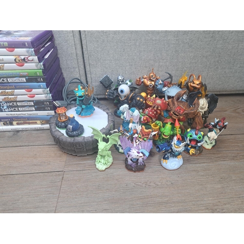 788 - A Microsoft Xbox 360 S console with Kinect unit, games and a large collection of Skylanders Giants f... 