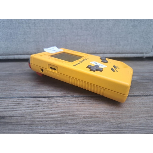 790 - A yellow Nintendo GameBoy DMG-01 with GameBoy Camera module