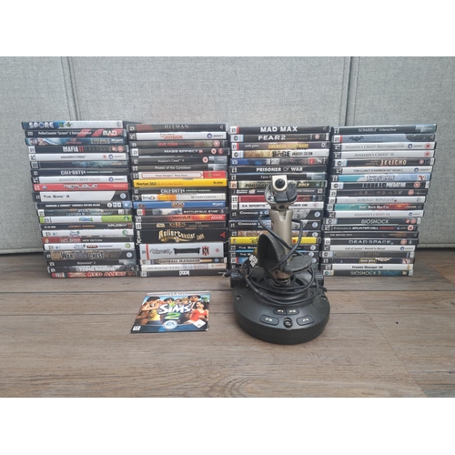 799 - A large quantity of PC and Mac games together with Saitek USB flight stick controller