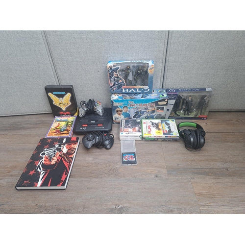 800 - A collection of gaming related items to include SEGA Mega Drive II with controller, Red Dead Redempt... 