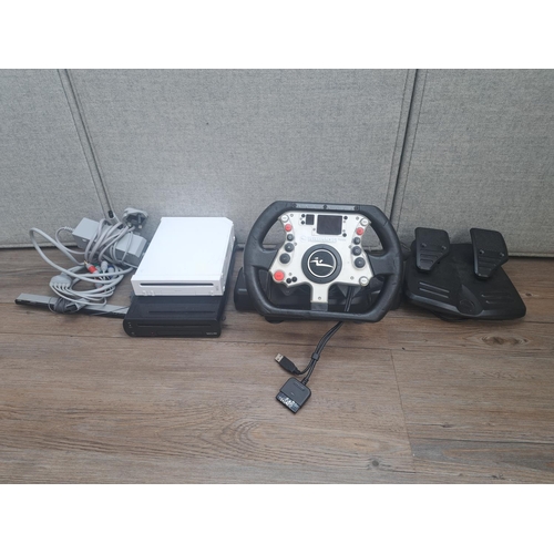 801 - Two Nintendo consoles, one Wii and one WiiU together with a Williams F1 Team PlayStation racing whee... 