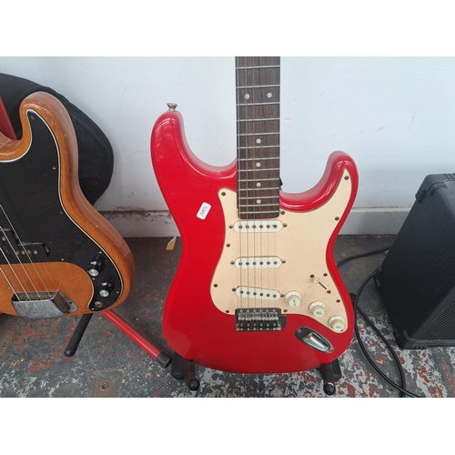 748 - Two items, one Crafter Junior Stratocaster style electric guitar and one Fender Frontman 15B bass am... 