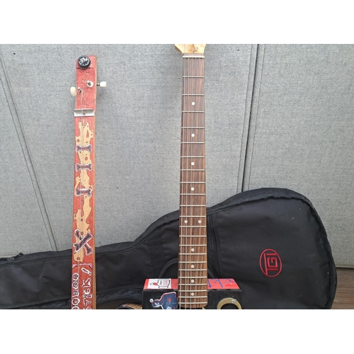 762 - Two cigar box guitars with one TGI case, one electric six-string with guitar neck and Camacho box an... 