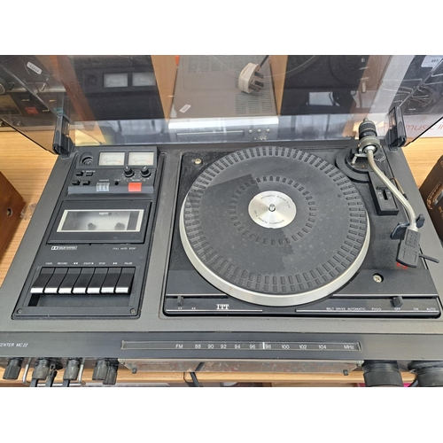 696 - A late 1970s ITT MC22 music centre comprising two-speed belt-drive turntable, Dolby cassette deck an... 