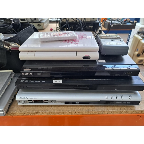 717 - A collection of AV items to include Panasonic DVD-LV75 portable DVD player, Sony DVP-SR750H DVD play... 