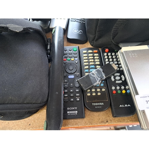 717 - A collection of AV items to include Panasonic DVD-LV75 portable DVD player, Sony DVP-SR750H DVD play... 