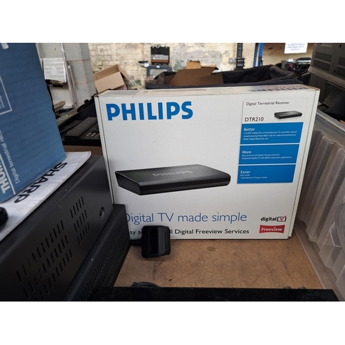 723 - A collection of AV items to include boxed Philips DTR210 digital terrestrial receiver, Toshiba V425B... 