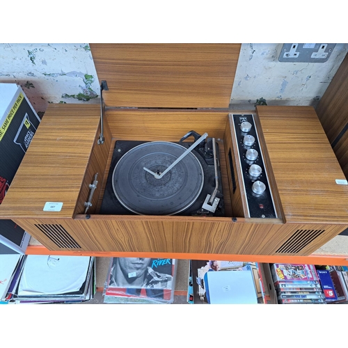 687 - A vintage HMV model 21417 sterogram comprising Garrard 2025TC four-speed autochanger turntable and a... 