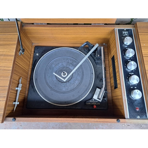 687 - A vintage HMV model 21417 sterogram comprising Garrard 2025TC four-speed autochanger turntable and a... 