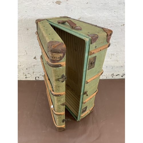 100 - An early 20th century green canvas and beech banded travel trunk - approx. 33cm high x 93cm wide x 5... 