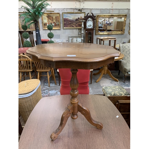 102 - An Italian style inlaid walnut effect serpentine tripod side table