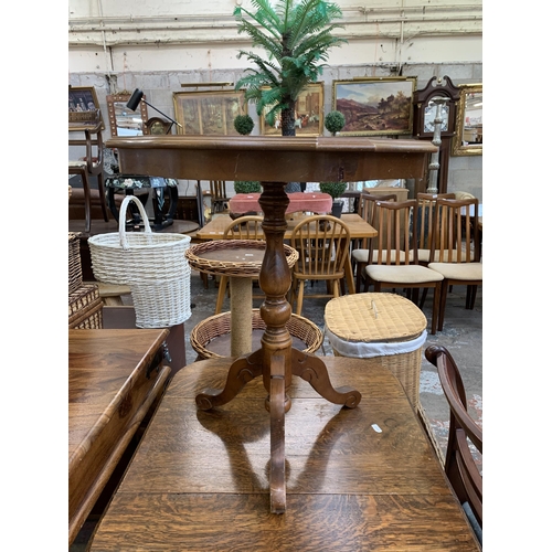 102 - An Italian style inlaid walnut effect serpentine tripod side table