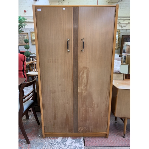 104 - A 1960s C.W.S. Ltd. walnut double wardrobe