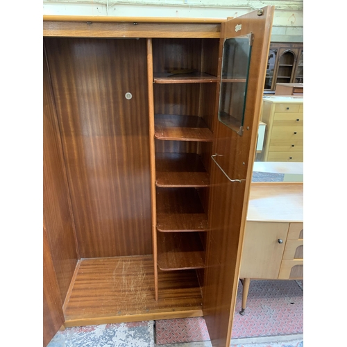 104 - A 1960s C.W.S. Ltd. walnut double wardrobe