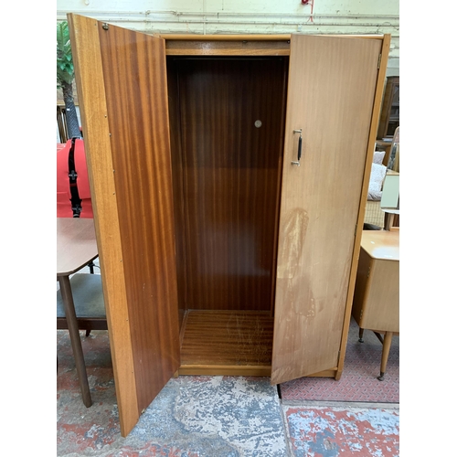 104 - A 1960s C.W.S. Ltd. walnut double wardrobe