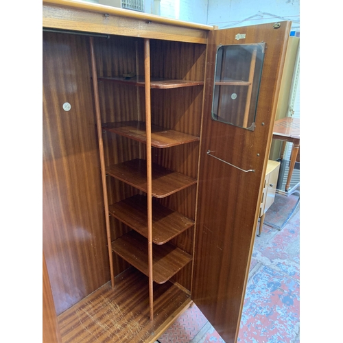 104 - A 1960s C.W.S. Ltd. walnut double wardrobe