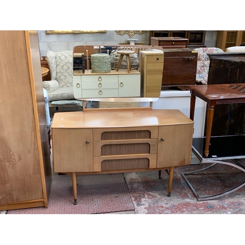 105 - A 1960s C.W.S. Ltd. walnut and teak effect dressing table