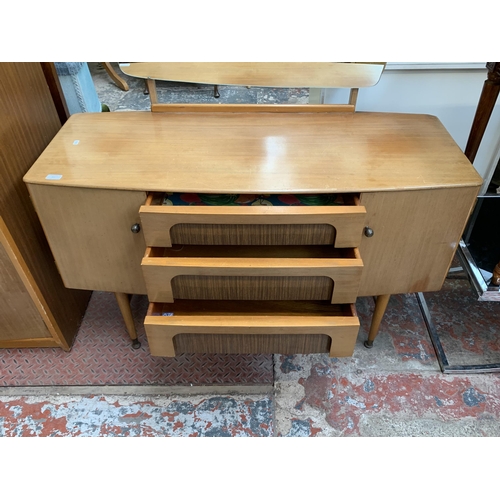 105 - A 1960s C.W.S. Ltd. walnut and teak effect dressing table