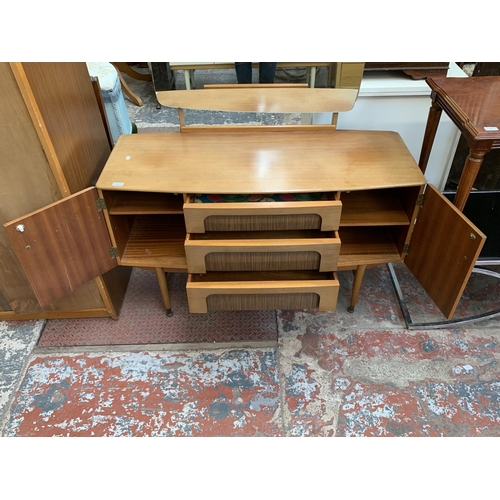 105 - A 1960s C.W.S. Ltd. walnut and teak effect dressing table