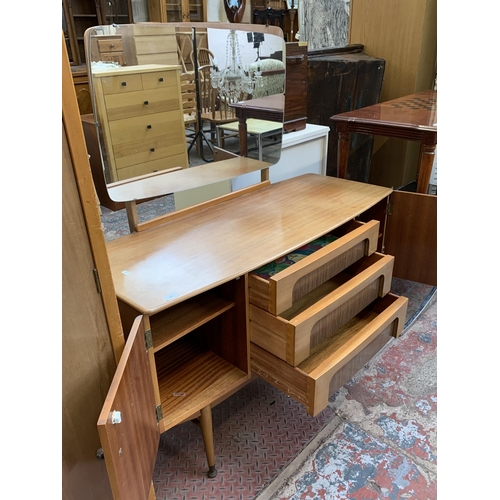 105 - A 1960s C.W.S. Ltd. walnut and teak effect dressing table