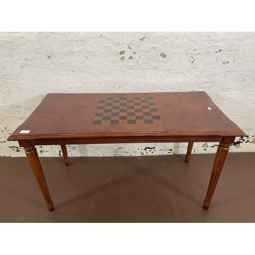 106 - A 19th century style burr walnut effect games coffee table - approx. 55cm high x 50cm wide x 100cm l... 