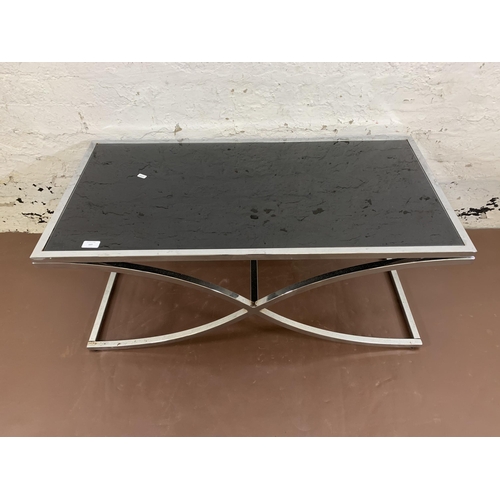 107 - A modern chrome plated and black glass rectangular coffee table