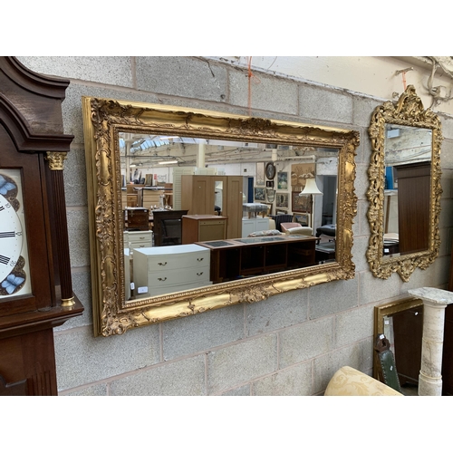 11 - A 19th century style gilt framed bevelled edge wall mirror - approx. 87cm high x 147cm wide