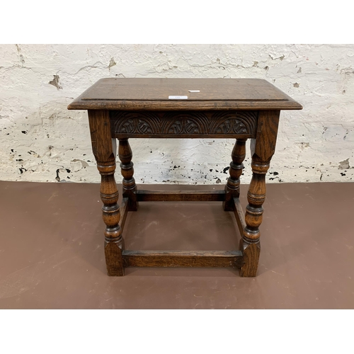 110 - A 17th century style carved oak joint side table - approx. 47cm high x 46cm wide x 25cm deep