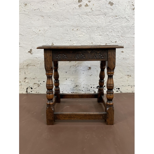 110 - A 17th century style carved oak joint side table - approx. 47cm high x 46cm wide x 25cm deep