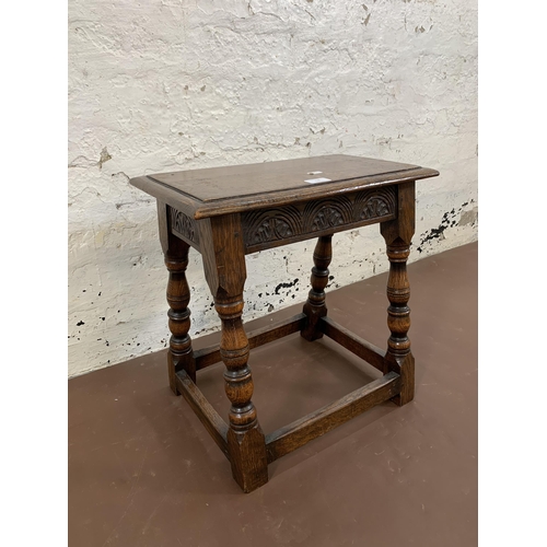 110 - A 17th century style carved oak joint side table - approx. 47cm high x 46cm wide x 25cm deep